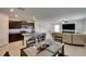 Bright living area featuring a central island, modern appliances, and an open layout for easy entertaining at 9907 Spanish Lime Ct, Riverview, FL 33578