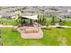 Community playground featuring swings and slides, perfect for outdoor activities at 9907 Spanish Lime Ct, Riverview, FL 33578