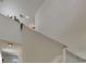 Upstairs hallway featuring minimalist decor with green plants at 9907 Spanish Lime Ct, Riverview, FL 33578