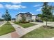 Charming two-story home situated on a corner lot with flourishing landscaping and a wide concrete sidewalk at 9907 Spanish Lime Ct, Riverview, FL 33578