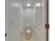 Bright, tiled half-bathroom featuring a toilet and neutral colored walls at 9907 Spanish Lime Ct, Riverview, FL 33578