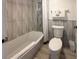 Cozy bathroom with modern tiled walls, updated fixtures, and clean bright feel at 9980 Gulf Blvd # 603, Treasure Island, FL 33706
