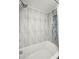 Modern bathroom featuring textured tiles and a new shower head for a spa-like experience at 9980 Gulf Blvd # 603, Treasure Island, FL 33706