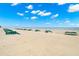 A pristine, sandy beach with clear blue skies, perfect for relaxation and seaside enjoyment at 9980 Gulf Blvd # 603, Treasure Island, FL 33706