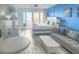 Inviting bedroom featuring a king bed, seating area, ocean views, and coastal decor for a relaxing stay at 9980 Gulf Blvd # 603, Treasure Island, FL 33706