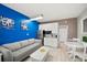 A stylish living area featuring a cozy sofa, kitchenette, and dining table, perfect for relaxing after a beach day at 9980 Gulf Blvd # 603, Treasure Island, FL 33706