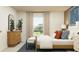 Tranquil bedroom with a neutral color palette, modern furniture, and a relaxing ambiance at 10282 Purple Leaf Ct, Riverview, FL 33578