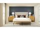 Serene bedroom with a navy accent wall, neutral bedding, and matching nightstands at 10282 Purple Leaf Ct, Riverview, FL 33578