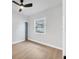 Bedroom features wood-look flooring, fresh paint, and ample natural light at 1045 22Nd N Ave, St Petersburg, FL 33704