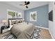 Tastefully staged bedroom with natural light, ceiling fan and plush rug at 1045 22Nd N Ave, St Petersburg, FL 33704