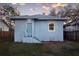 Charming home featuring a light blue exterior with a well-maintained front yard at 1045 22Nd N Ave, St Petersburg, FL 33704