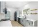 Contemporary kitchen showcasing stainless steel appliances, blue cabinets, and a white backsplash at 1045 22Nd N Ave, St Petersburg, FL 33704