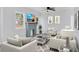 Comfortable living room with modern furnishings, a stylish fireplace, and ample seating at 1045 22Nd N Ave, St Petersburg, FL 33704
