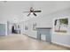Open-concept living room with a stylish blue brick fireplace and a seamless flow to the kitchen at 1045 22Nd N Ave, St Petersburg, FL 33704