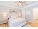 Serene bedroom with a cozy bed, soft lighting, and access to an en-suite bathroom at 10473 Villa View Cir, Tampa, FL 33647