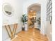 Stylish entryway leading to an open floor plan with a modern kitchen and comfortable living area at 10473 Villa View Cir, Tampa, FL 33647