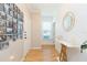 Bright entryway with hardwood floors, offering a warm welcome with decorative accents at 10473 Villa View Cir, Tampa, FL 33647