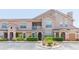 Charming condo featuring a landscaped yard and a classic architectural style with a cozy balcony at 10473 Villa View Cir, Tampa, FL 33647