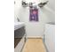 The laundry room includes a washer, dryer, and storage shelf for supplies at 10473 Villa View Cir, Tampa, FL 33647