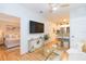 Bright living room with stylish furniture flowing into a modern kitchen with stainless steel appliances at 10473 Villa View Cir, Tampa, FL 33647