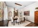 The formal dining room features stylish decor, hardwood floors, and a picturesque window at 1133 Split Silk St, Valrico, FL 33594