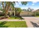 Charming two-story home features a well-manicured lawn and an attached three-car garage at 1133 Split Silk St, Valrico, FL 33594
