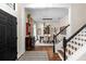 Inviting foyer features a staircase, hardwood floors, and access to the formal dining room at 1133 Split Silk St, Valrico, FL 33594
