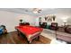 Spacious game room featuring a pool table, comfortable seating, and plenty of room for entertaining at 1133 Split Silk St, Valrico, FL 33594