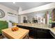 Open kitchen with granite countertops, a butcher block island, stainless steel appliances, and seamless flow to the living area at 1133 Split Silk St, Valrico, FL 33594