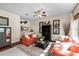Bright living room with ample seating, a wet bar, and abundant natural light at 1133 Split Silk St, Valrico, FL 33594