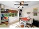 Office space featuring a window, shelving and a craft space with sewing machine at 1133 Split Silk St, Valrico, FL 33594