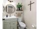 The powder room features a stylish vanity, a designer mirror, and modern fixtures at 1133 Split Silk St, Valrico, FL 33594