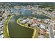Breathtaking aerial view showcases a pink home nestled among lakes within a quiet neighborhood at 1207 Norwich Cir, Sun City Center, FL 33573