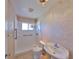 Bathroom with walk-in shower, safety bars, and sink at 1207 Norwich Cir, Sun City Center, FL 33573