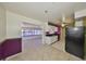 Open concept kitchen with granite countertops and a view of the water at 1207 Norwich Cir, Sun City Center, FL 33573