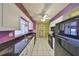 Updated kitchen with stainless steel appliances and eat-in breakfast bar at 1207 Norwich Cir, Sun City Center, FL 33573