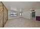Open living area with bright natural light from a large window at 1207 Norwich Cir, Sun City Center, FL 33573