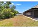 Spacious backyard with a screened lanai, perfect for outdoor living and entertaining in a serene setting at 12150 Ledbury Commons Dr, Gibsonton, FL 33534