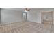 Spacious bedroom features neutral walls, carpet, a ceiling fan, and a closet at 12150 Ledbury Commons Dr, Gibsonton, FL 33534