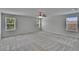 Spacious bedroom features neutral walls, carpet, a ceiling fan, and plenty of natural light at 12150 Ledbury Commons Dr, Gibsonton, FL 33534