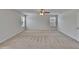 Spacious bedroom features neutral walls, carpet, a ceiling fan, and plenty of natural light at 12150 Ledbury Commons Dr, Gibsonton, FL 33534