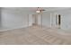 Spacious bedroom features neutral walls, carpet, a ceiling fan, and two closets at 12150 Ledbury Commons Dr, Gibsonton, FL 33534