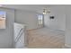 Spacious bonus room features neutral walls, carpet, a ceiling fan, and plenty of natural light at 12150 Ledbury Commons Dr, Gibsonton, FL 33534