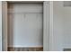 Open walk-in closet with wire shelving and carpeted floor at 12150 Ledbury Commons Dr, Gibsonton, FL 33534