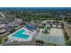 Aerial view of community amenities featuring a pool, playground, tennis courts, and recreational facilities at 12150 Ledbury Commons Dr, Gibsonton, FL 33534