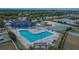 Aerial view of the community pool, playground, and tennis courts, perfect for Gathering fun and recreation at 12150 Ledbury Commons Dr, Gibsonton, FL 33534