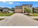 Two-story home with a spacious driveway, attached garage, and well-maintained lawn at 12150 Ledbury Commons Dr, Gibsonton, FL 33534