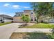 Spacious two-story home with a two-car garage and a well-kept lawn at 12150 Ledbury Commons Dr, Gibsonton, FL 33534