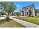 Charming two-story home with a landscaped front yard and a paved walkway at 12150 Ledbury Commons Dr, Gibsonton, FL 33534