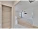 Hallway featuring a storage closet and view to the Gathering room with a ceiling fan at 12150 Ledbury Commons Dr, Gibsonton, FL 33534